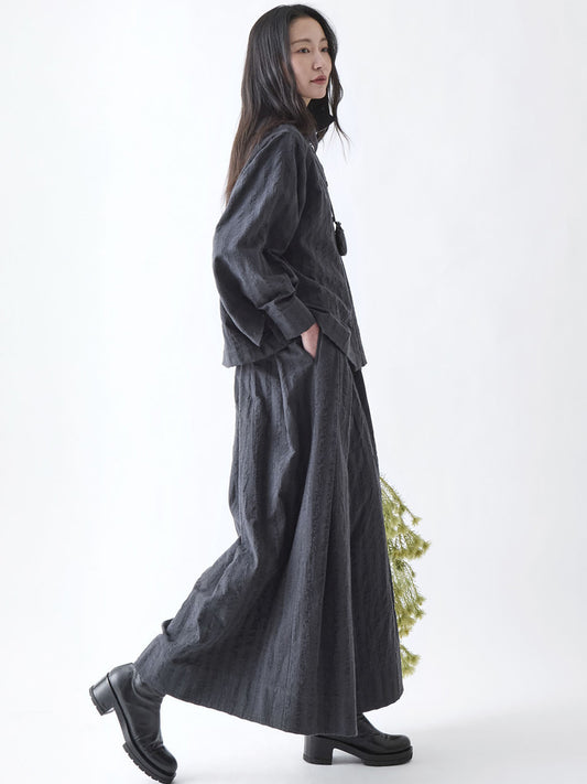 Soh side view of check shirt showing wide sleeve and straight hem