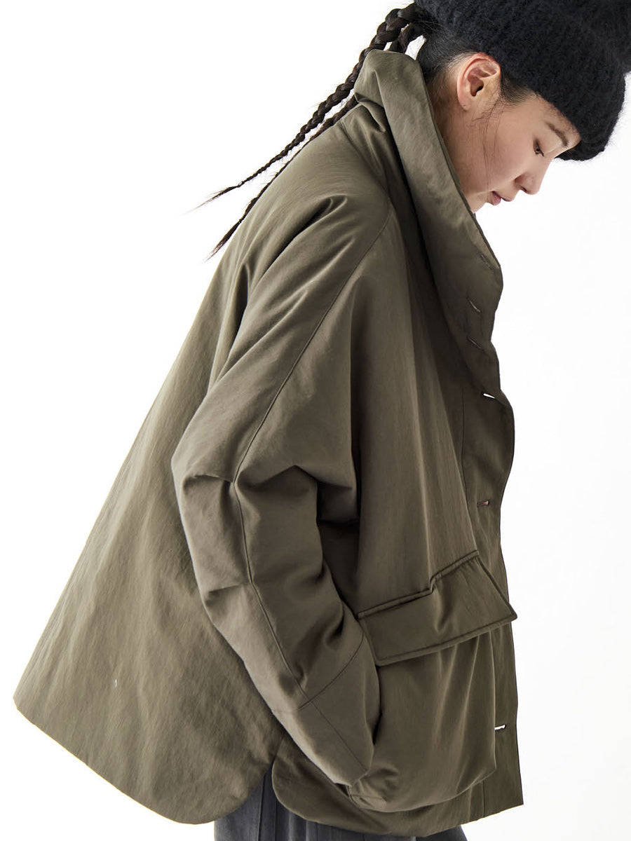 Soh side view of khaki jacket showing rounded back and high collar