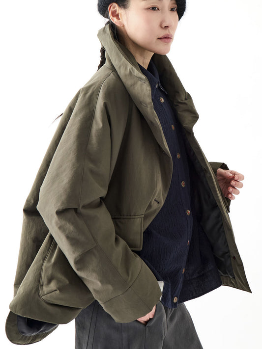Soh three-quarter view of khaki jacket showing broad sleeve and flap pocket