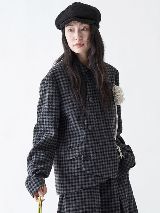 Soh three-quarter view of double-breasted check jacket