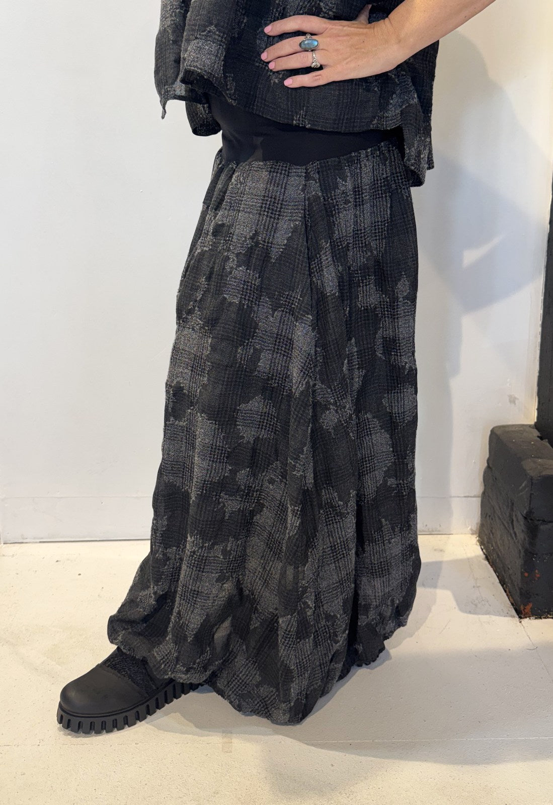 Side view of the Freesia skirt showing soft folds and its gently flared shape