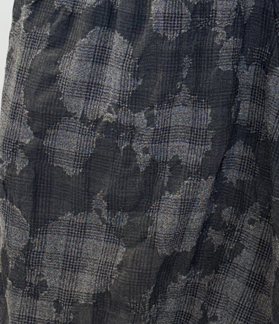 Close-up of the Freesia skirt showing its textured checked weave