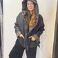 Igor Dobranic Hibiscus reversible jacket: plain black front with hood up and patterned reverse visible