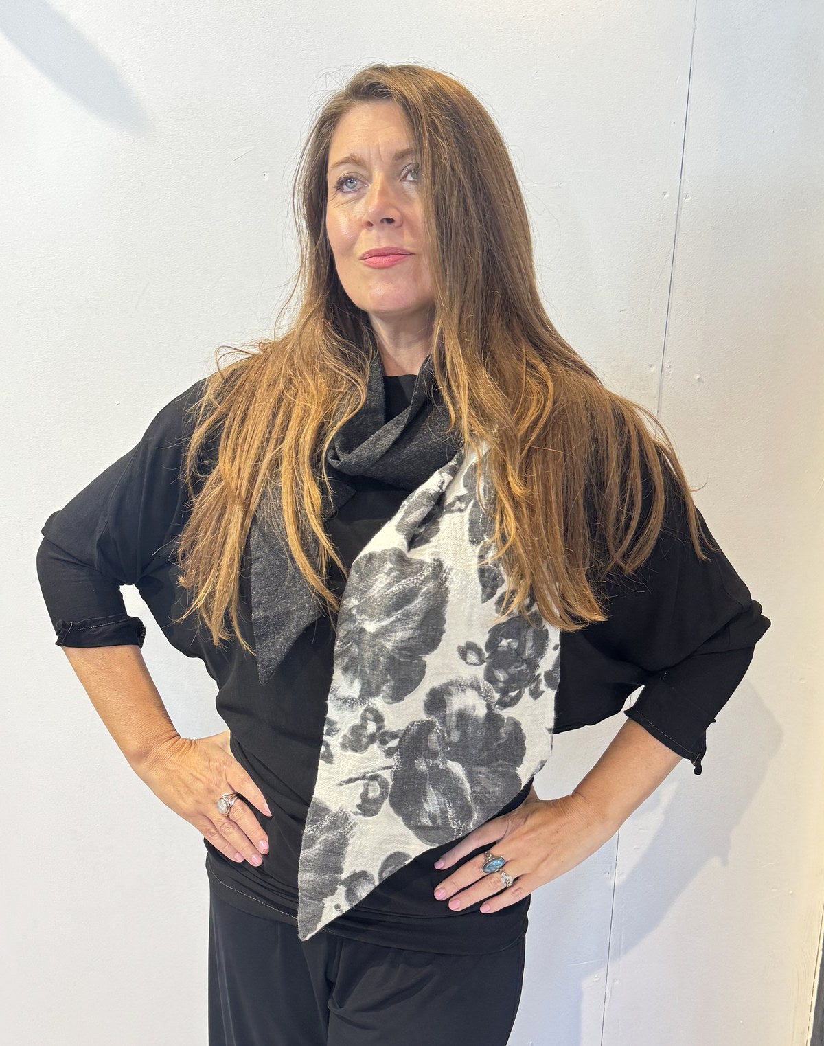 Igor Dobranic Imortelle grey floral scarf draped around the neck with its contrasting charcoal section
