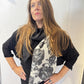 Closer view of the Imortelle scarf showing its floral panel and angled end