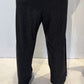 Back view of the Ivy dark grey trousers showing their tapered legs