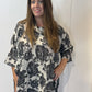 Front view of the Igor Dobranic Lantana grey floral tunic with an uneven hem