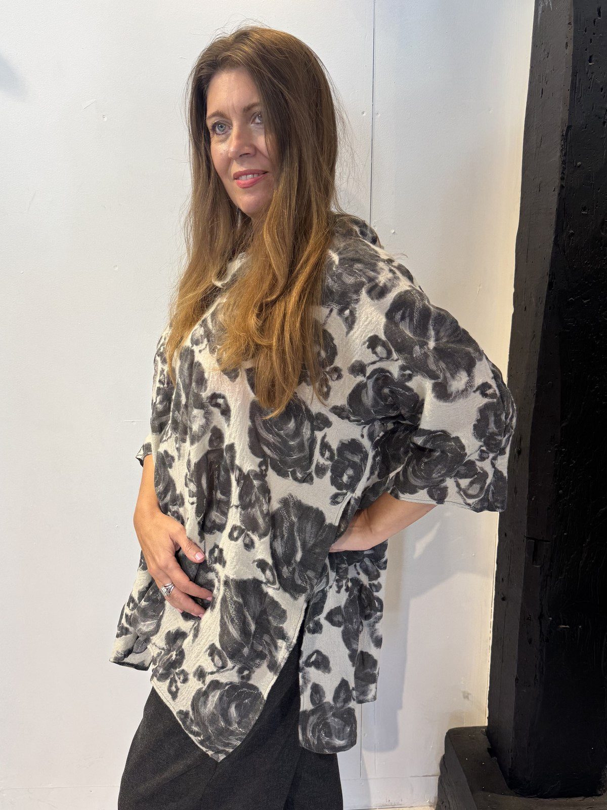 Side view of the Lantana tunic showing the elbow-length sleeve and curved hem