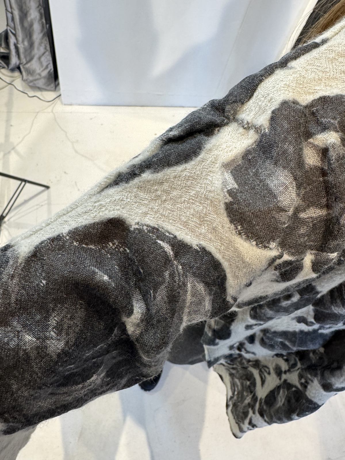 Close-up of the Lantana tunic’s textured wool fabric and floral design