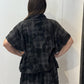 Back view of the Lotus waistcoat in grey and charcoal checks