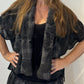 Detail of the Lotus waistcoat showing its textured checked weave and broad front edge