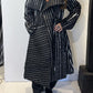 Igor Dobranic Magnolia black and white coat worn open, showing its broad lapels and contrasting stripe directions