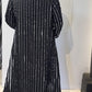 Back view of the Magnolia coat showing vertical white stripes and a gently flared hem
