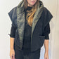 Front view of the Igor Dobranic Pensy reversible waistcoat showing the plain black side and green patterned collar