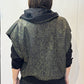 Back view of the Pensy waistcoat showing its green pattern with the hood down