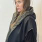 Side view of the Pensy waistcoat showing its plain black side and patch pocket