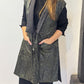 Front view of the Igor Dobranic Rue waistcoat showing its black and green pattern and black lapels