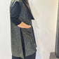 Side view of the Rue waistcoat showing its long silhouette and patch pocket