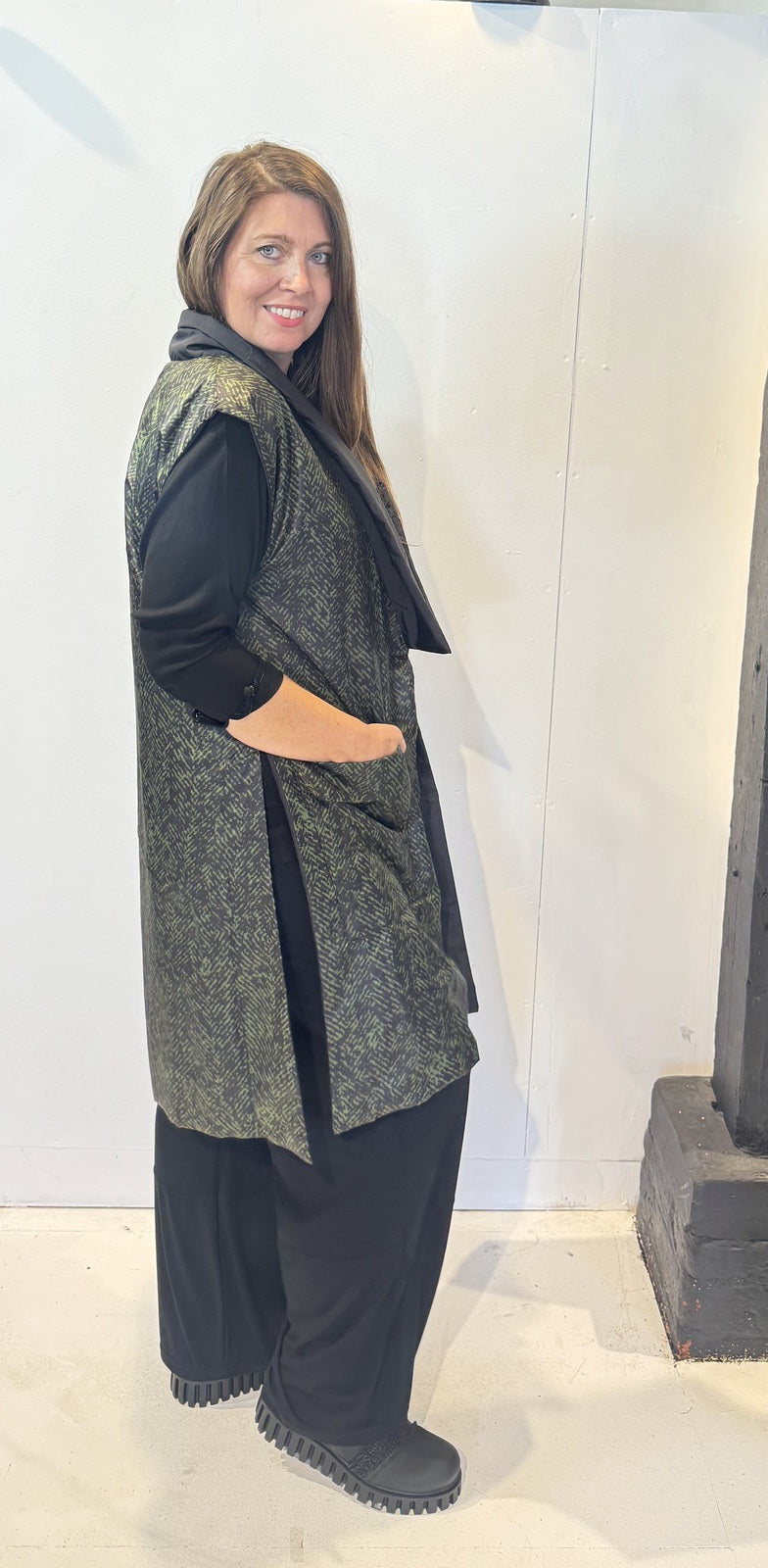 Side view of the Rue waistcoat showing its long silhouette and patch pocket