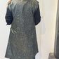 Back view of the Rue waistcoat showing the abstract green pattern and extended shoulders