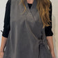 Detail of the Senna waistcoat showing its V-neckline, pinstriped panels and side tie