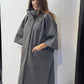 Three-quarter side view of the Sorrel grey coat with wide cropped sleeves