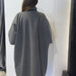 Back view of the Sorrel grey coat showing its sculptural silhouette