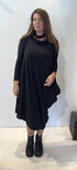Front view of the Igor Dobranic Strelizia black dress showing its draped asymmetric hem