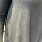 Close-up of the Strelizia dress showing its subtly crinkled fabric