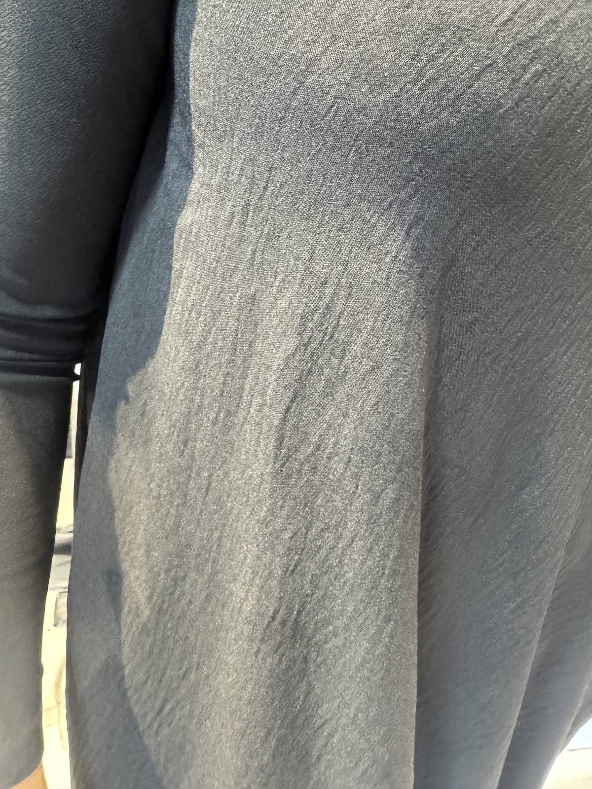Close-up of the Strelizia dress showing its subtly crinkled fabric