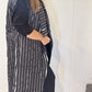 Side view of the Tulip waistcoat showing its side pocket and long striped silhouette