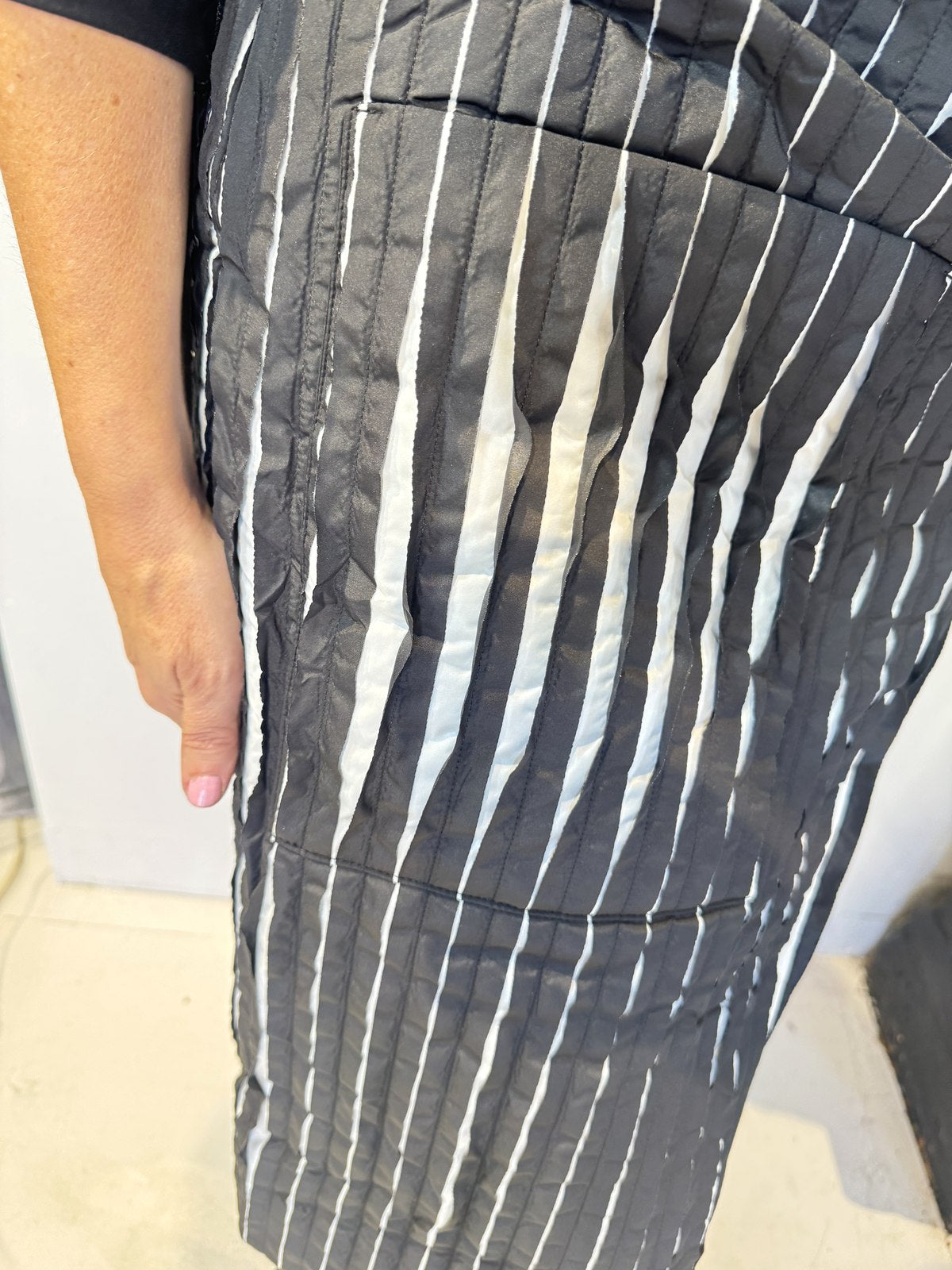 Close-up of the Tulip waistcoat showing its raised, rippled black and white striped texture
