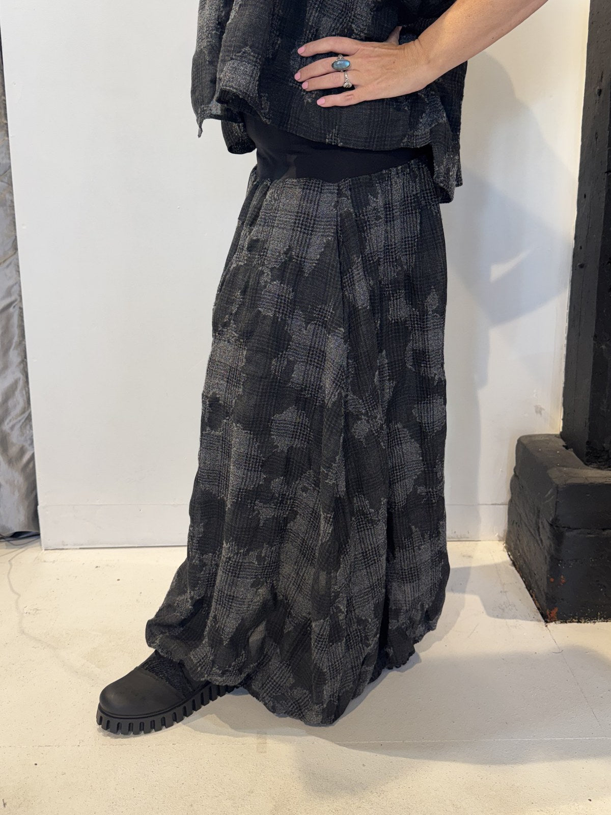 Side view of the Freesia skirt showing soft folds and its gently flared shape