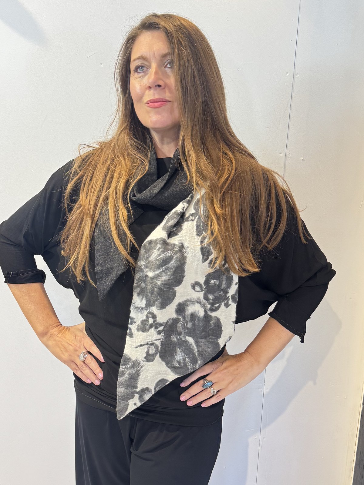 Igor Dobranic Imortelle grey floral scarf draped around the neck with its contrasting charcoal section