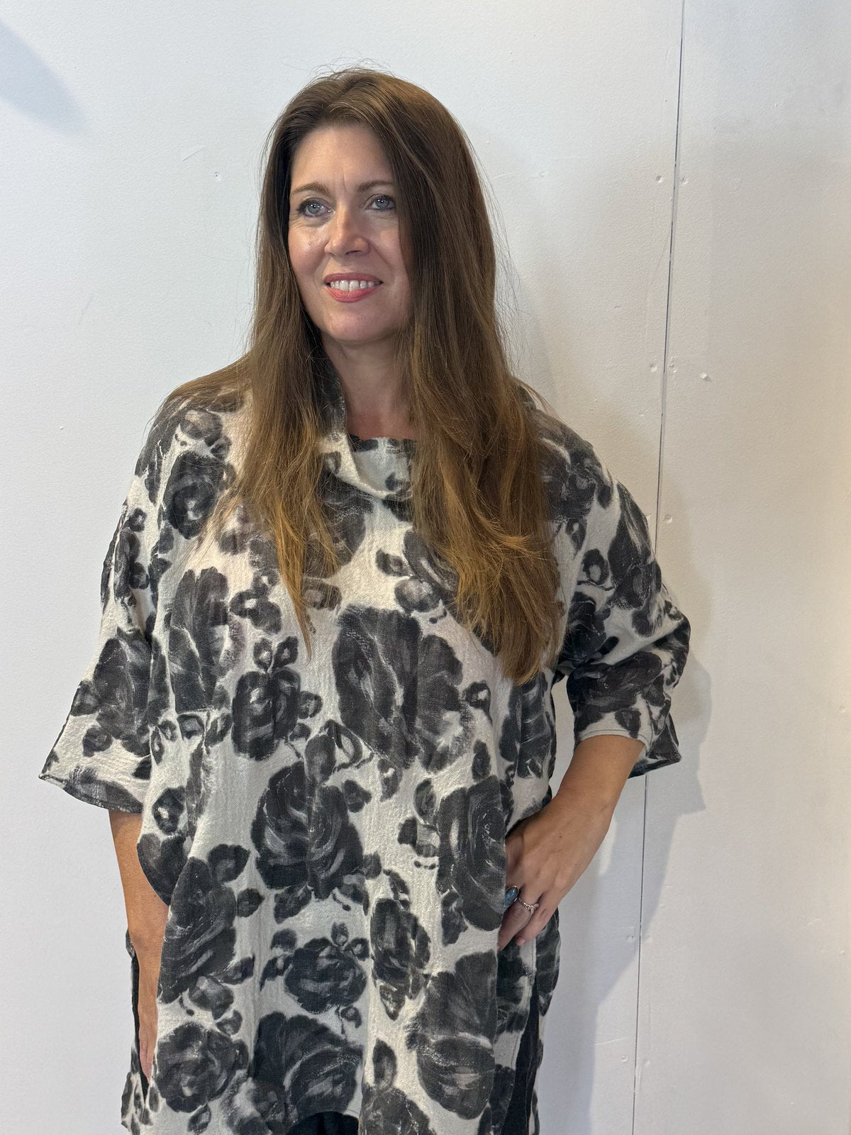 Front view of the Igor Dobranic Lantana grey floral tunic with an uneven hem