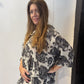Side view of the Lantana tunic showing the elbow-length sleeve and curved hem