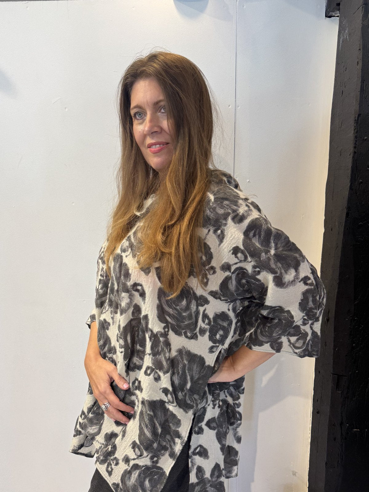 Side view of the Lantana tunic showing the elbow-length sleeve and curved hem