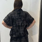 Back view of the Lotus waistcoat in grey and charcoal checks