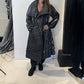 Igor Dobranic Magnolia black and white coat worn open, showing its broad lapels and contrasting stripe directions