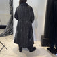Back view of the Magnolia coat showing vertical white stripes and a gently flared hem