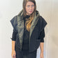 Front view of the Igor Dobranic Pensy reversible waistcoat showing the plain black side and green patterned collar
