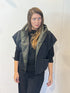 Front view of the Igor Dobranic Pensy reversible waistcoat showing the plain black side and green patterned collar