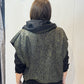 Back view of the Pensy waistcoat showing its green pattern with the hood down