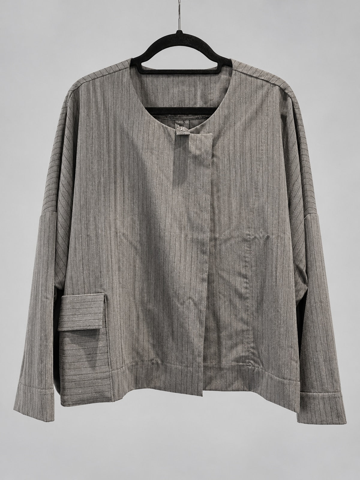 Front view of Igor Dobranic Petunia grey pinstriped jacket with round neckline and patch pocket