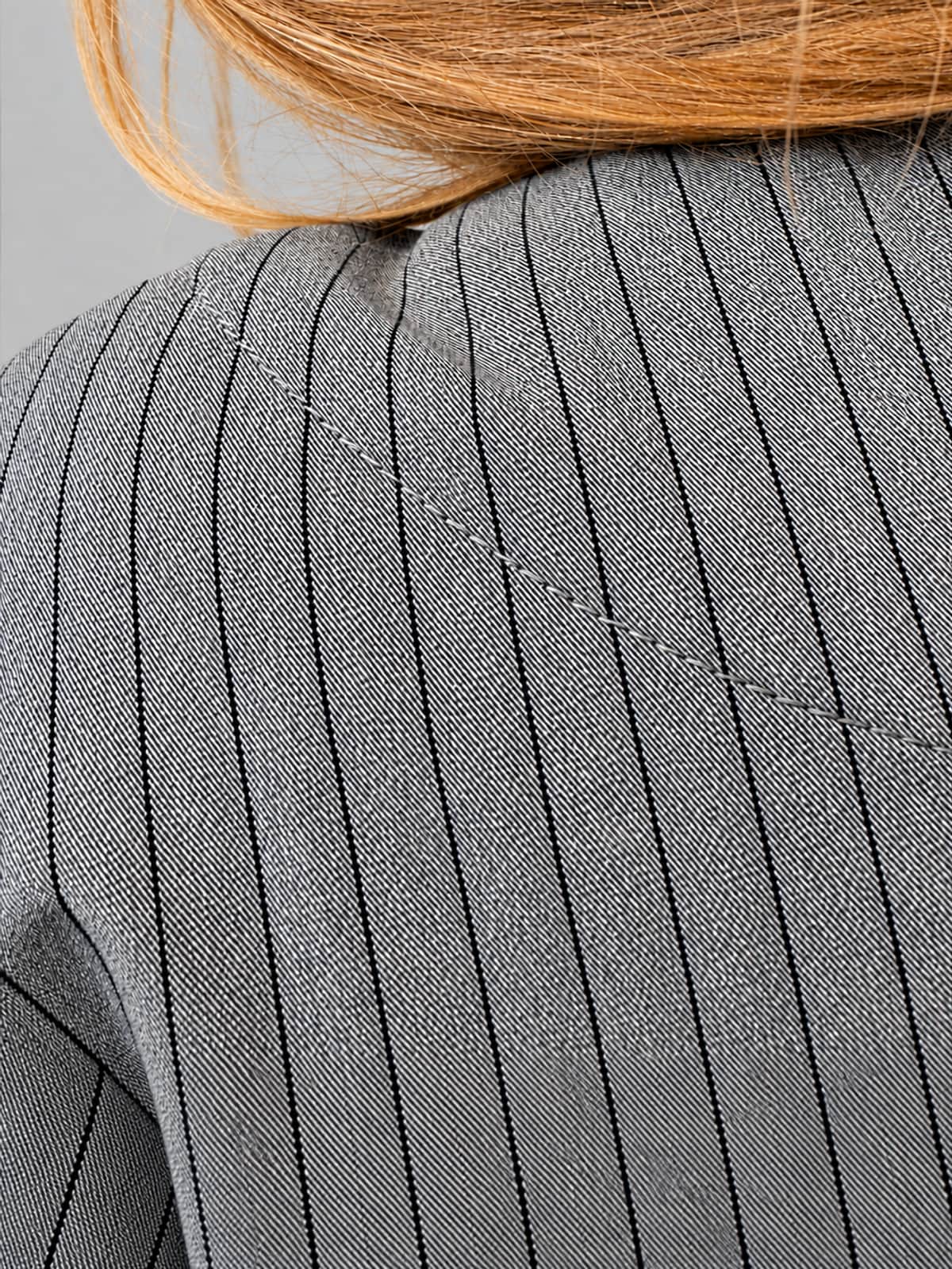 Igor Dobranic Petunia grey pinstriped jacket — close-up of grey pinstriped fabric