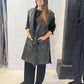 Front view of the Igor Dobranic Rue waistcoat showing its black and green pattern and black lapels