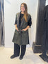 Front view of the Igor Dobranic Rue waistcoat showing its black and green pattern and black lapels
