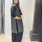 Side view of the Rue waistcoat showing its long silhouette and patch pocket