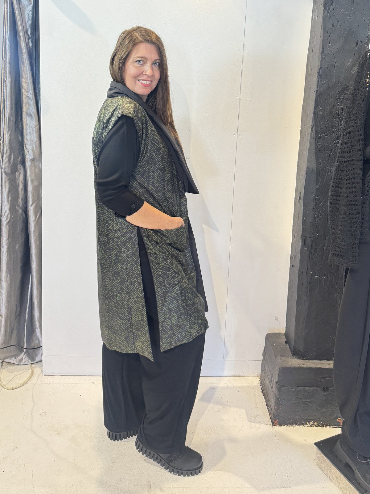 Side view of the Rue waistcoat showing its long silhouette and patch pocket