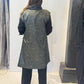 Back view of the Rue waistcoat showing the abstract green pattern and extended shoulders